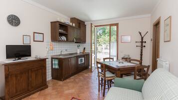 Family Apartment, 1 Bedroom | Living area | Flat-screen TV