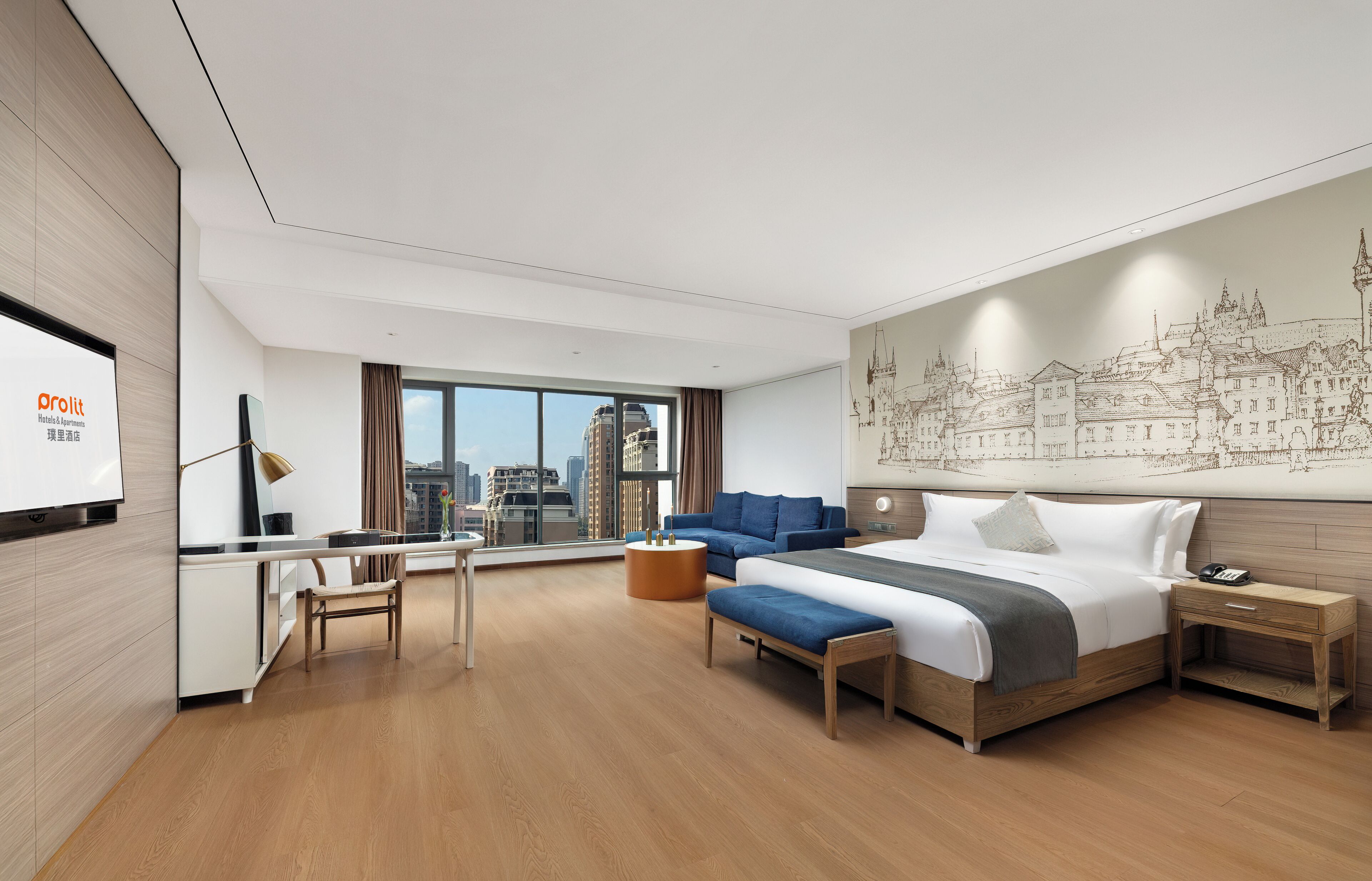 A modern hotel room with a large bed, a desk, a chair, and a city view.