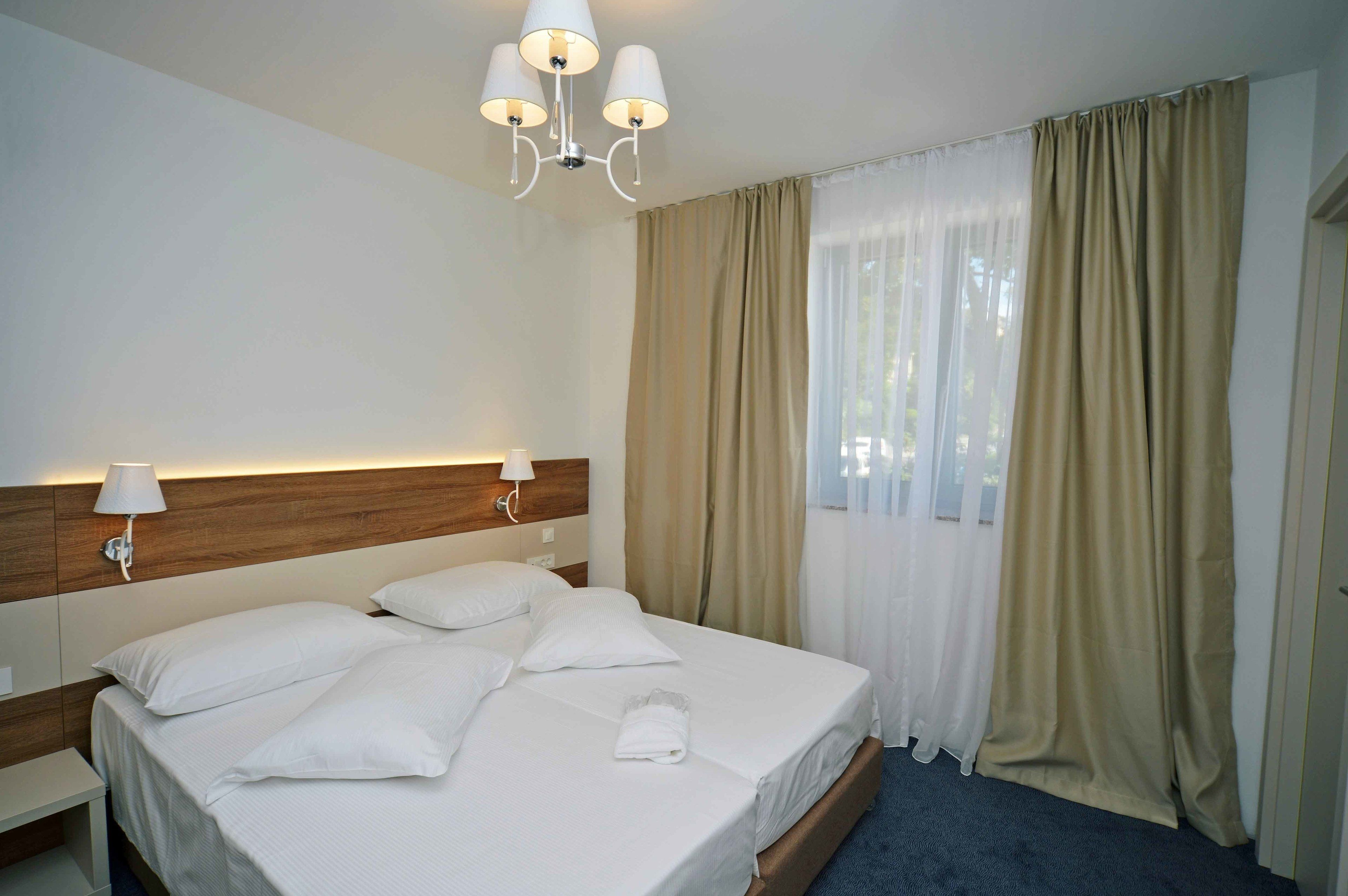 deluxe double or twin room | minibar, in-room safe, desk, iron/ironing board