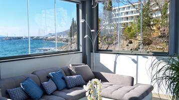 Superior Apartment, Kitchenette, Sea View | Minibar, in-room safe, desk, iron/ironing board