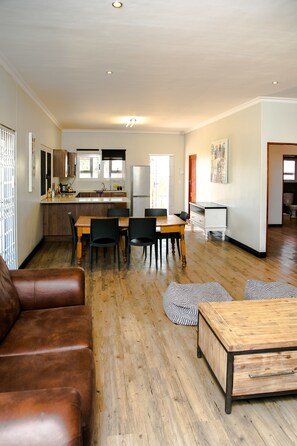 Exclusive Cottage, 2 Bedrooms | Living area | Flat-screen TV - Village Lodge Paarl (Paarl)