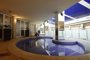 Indoor pool, seasonal outdoor pool, pool umbrellas, sun loungers