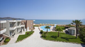A resort with a swimming pool, a beach, and a view of the sea. - Phaedra Hotel (Chania)