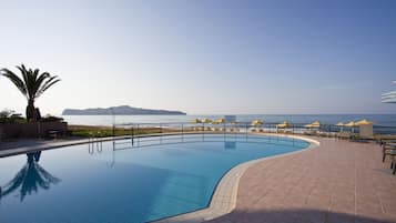 Outdoor pool, an infinity pool, open 8:00 AM to 8:00 PM, pool umbrellas