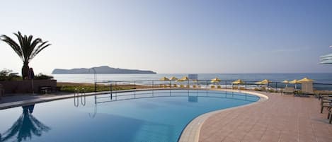 Outdoor pool, an infinity pool, open 8:00 AM to 8:00 PM, pool umbrellas