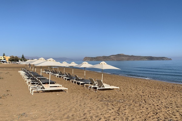 On the beach, sun loungers, beach umbrellas, beach towels