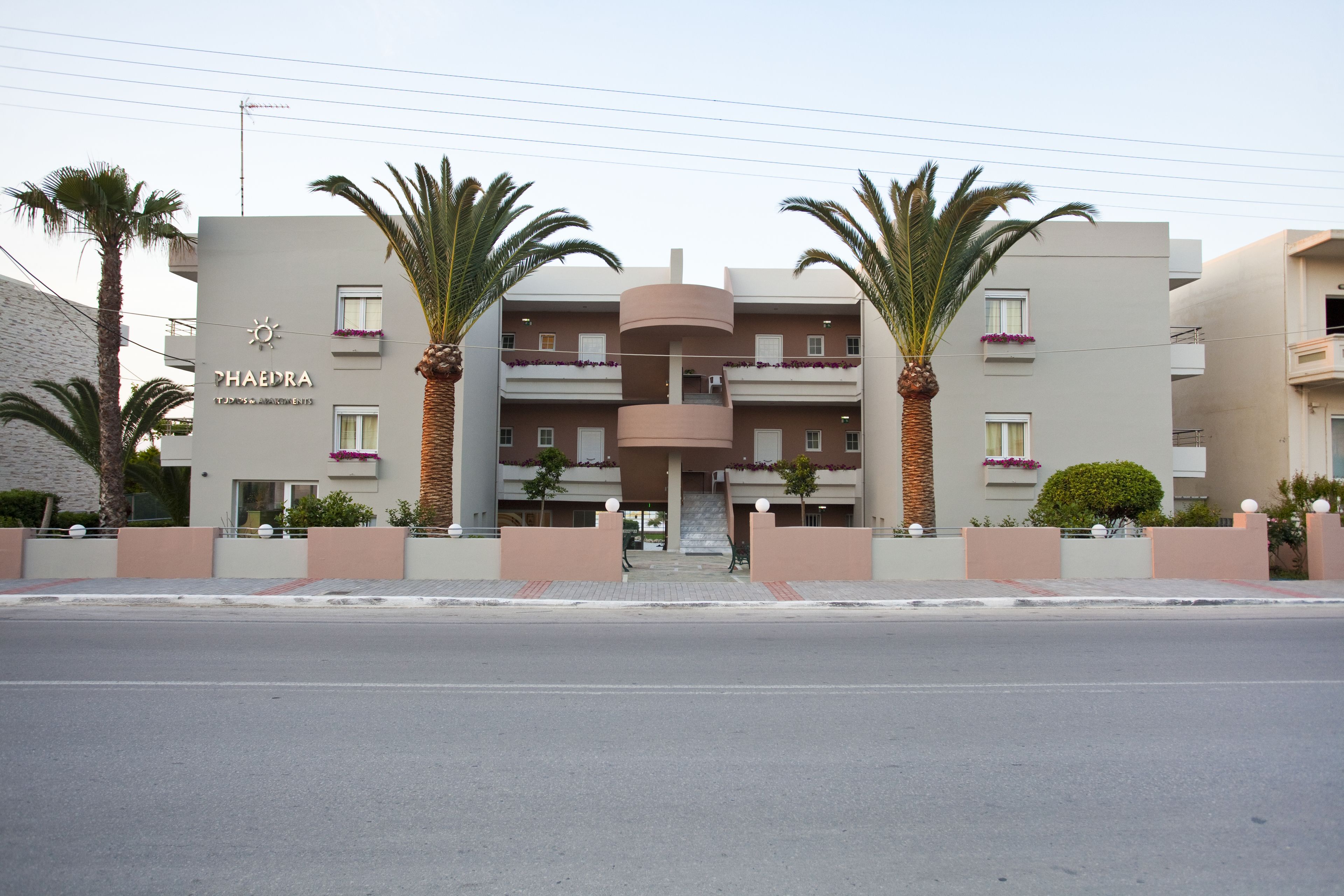 A modern building with a sign reading "PHAEDRA HOTEL".