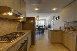 Superior Apartment, 3 Bedrooms, Garden View, Garden Area | Private kitchen | Full-sized fridge, microwave, oven, stovetop - El Portillo Beach (Las Terrenas)