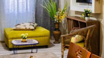 Standard Apartment, 3 Bedrooms | Living area | Flat-screen TV