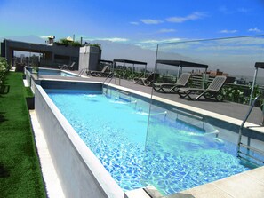 Seasonal outdoor pool, pool loungers