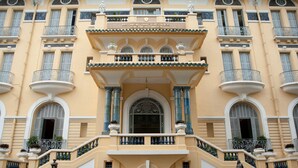 A building with a central entrance, ornate balconies, and a sign indicating it is the Hoa Sen Fine Arts Museum. - The Berry Vinhomes Luxury Apartments (Ho Chi Minh City)
