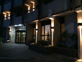 A hotel entrance with a sign reading "Hotel NICO".