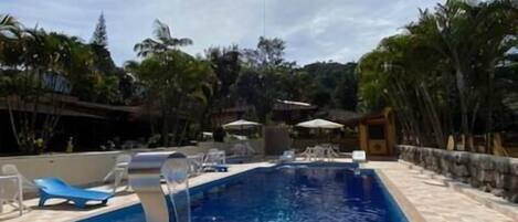 Outdoor pool, pool umbrellas, sun loungers