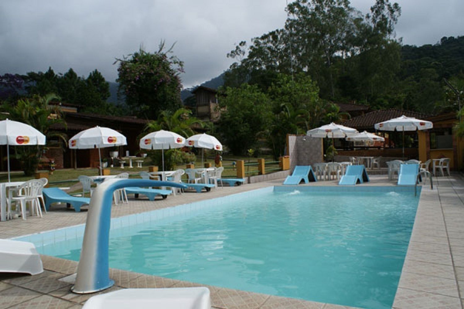 outdoor pool, pool umbrellas, pool loungers