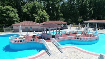 Seasonal outdoor pool, open 10:00 AM to 7:00 PM, pool umbrellas