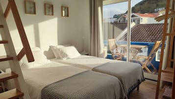 Double or Twin Room, Partial Sea View | Cots/infant beds, free WiFi, bed sheets