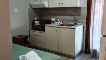 Family Apartment, Balcony, Sea Facing | Private kitchenette | Electric kettle