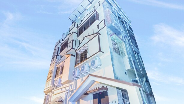 A modern building with a unique architectural design, featuring multiple levels and balconies. - OYO 9543 Rajarhat (Barasat)
