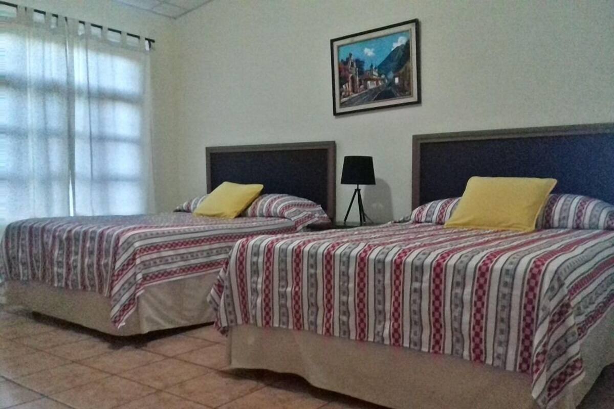 Traditional Quadruple Room, 2 Queen Beds, Non Smoking | Cribs (surcharge), rollaway beds (surcharge), WiFi (free), bed sheets