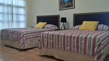 Traditional Quadruple Room, 2 Queen Beds, Non Smoking | Cribs/infant beds, rollaway beds, free WiFi, bed sheets