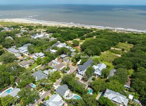 An aerial view of a residential area with houses, a beach access point, and a swimming pool labeled '7th Heaven'. - Seventh Heaven Beach House on East Beach with Private Pool! (St Simons Island)