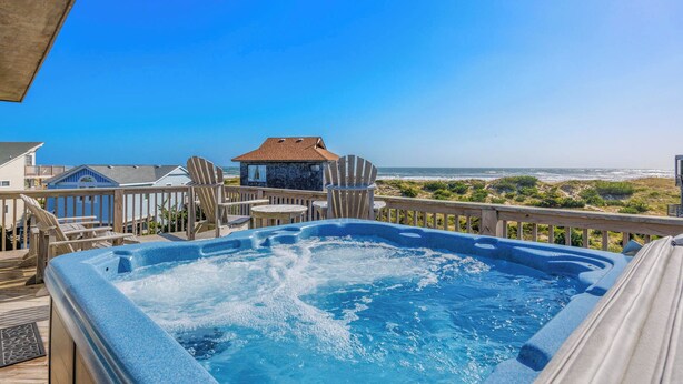 A hot tub on a wooden deck with a view of the ocean and beach houses. - Fantastic Views! Semi-Oceanfront in Avon, Hot-Tub, Dog-Friendly, Walk to Beach (Avon)
