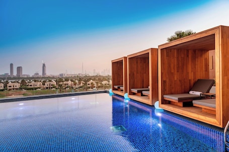 Outdoor pool, free cabanas, pool umbrellas. Aloft Dubai Creek