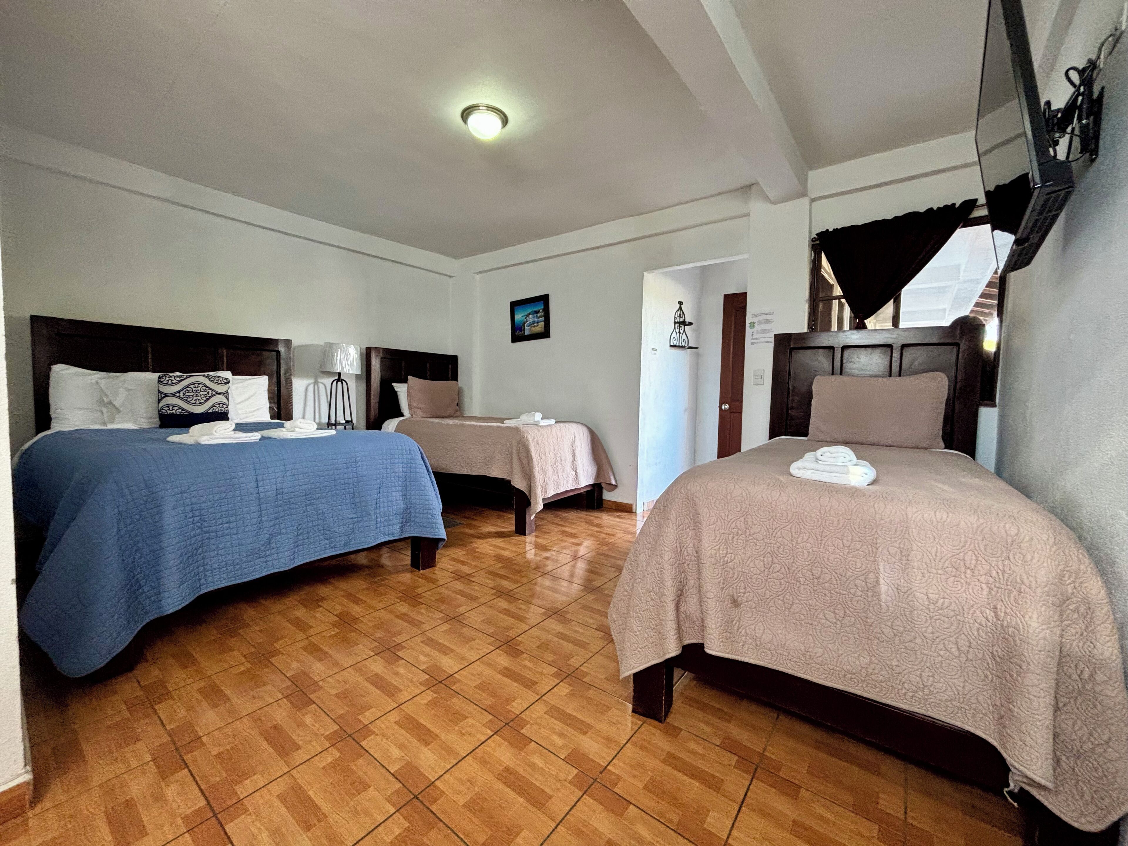 Quadruple Room, 2 Bedrooms, Non Smoking | Down duvets, blackout curtains, free WiFi, bed sheets