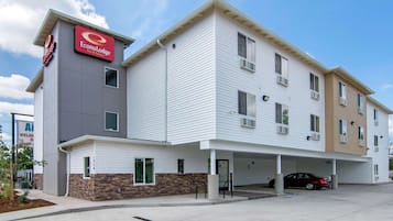 Stylish hotel building with a two-story design, featuring a flat roof and multiple windows.