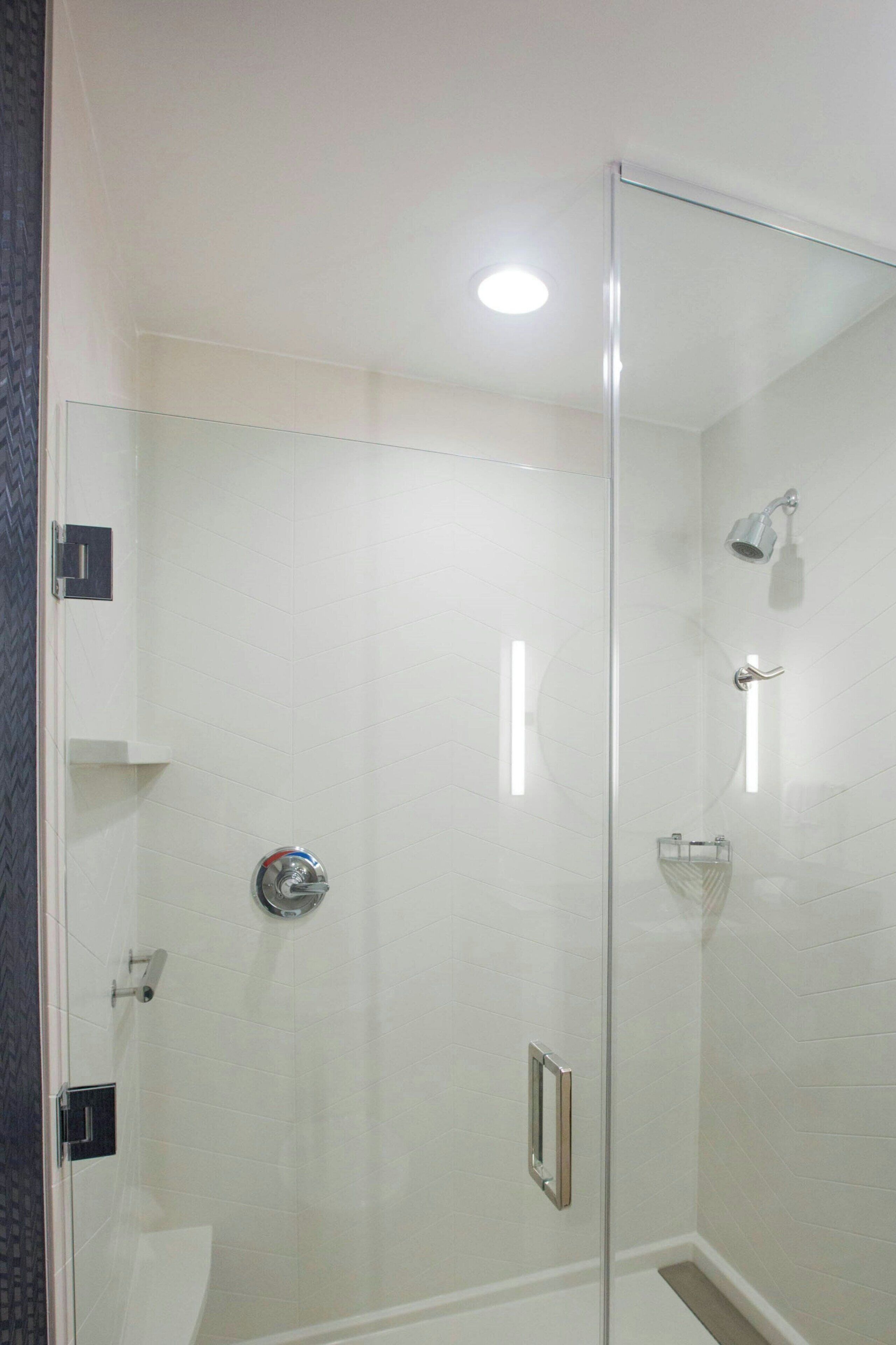 designer toiletries, hair dryer, towels, soap