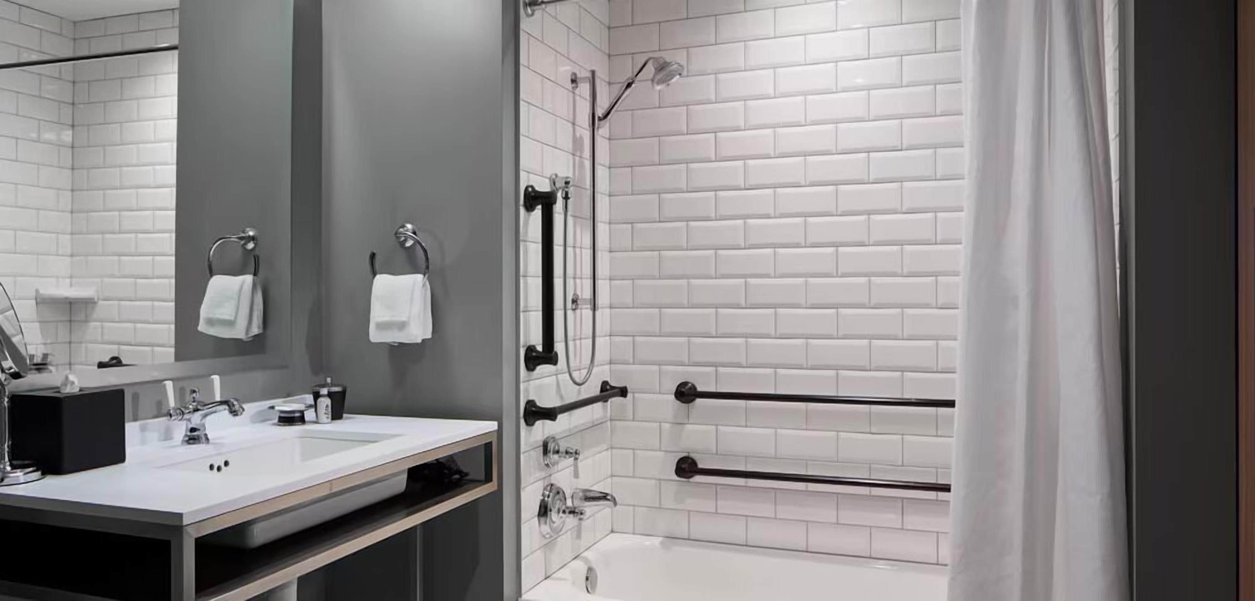 designer toiletries, hair dryer, bathrobes, towels