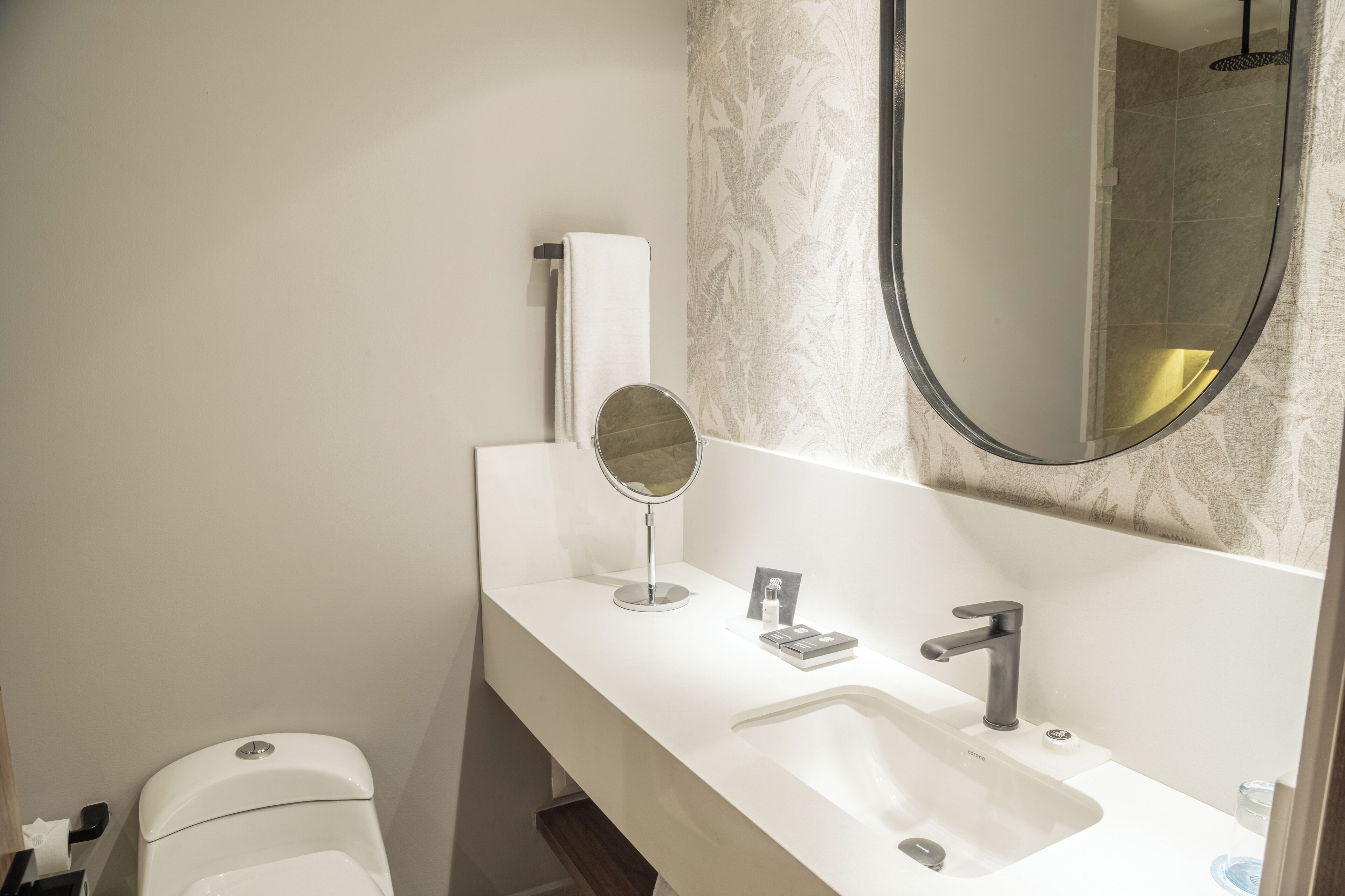 shower, designer toiletries, hair dryer, towels