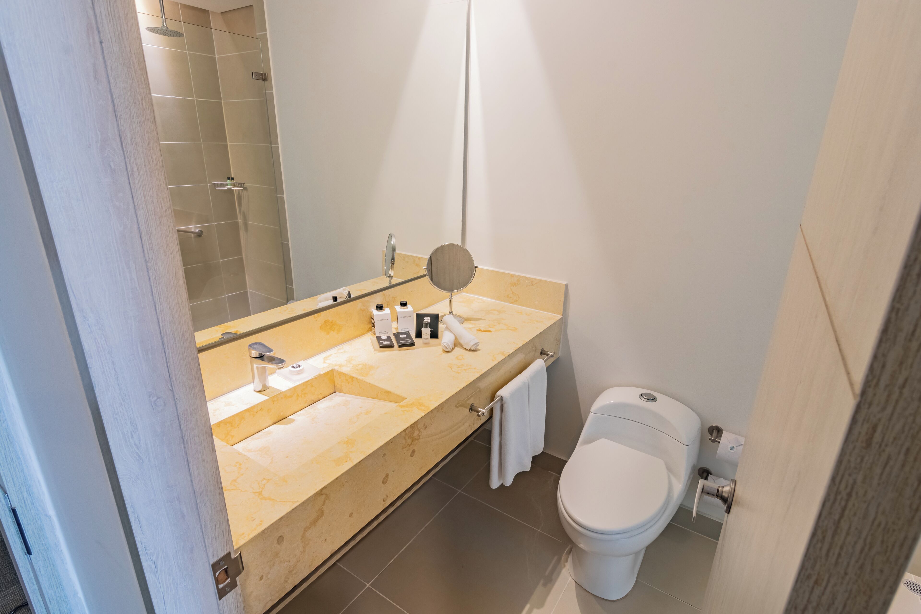 shower, designer toiletries, hair dryer, towels