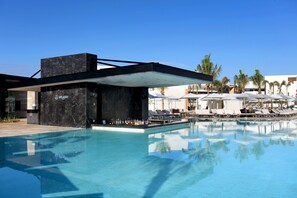 3 outdoor pools, open 8 AM to 8 PM, pool umbrellas, sun loungers