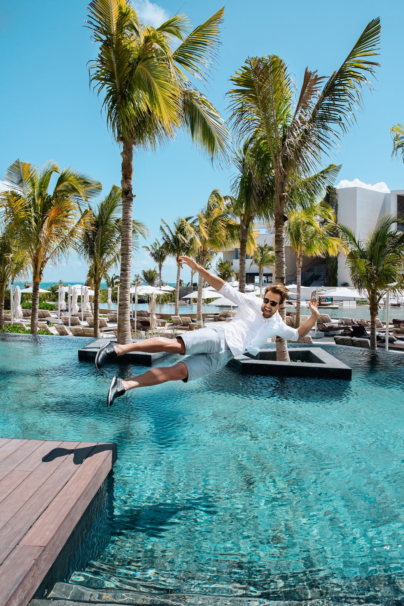 3 outdoor pools, open 8 AM to 8 PM, cabanas (surcharge), pool umbrellas