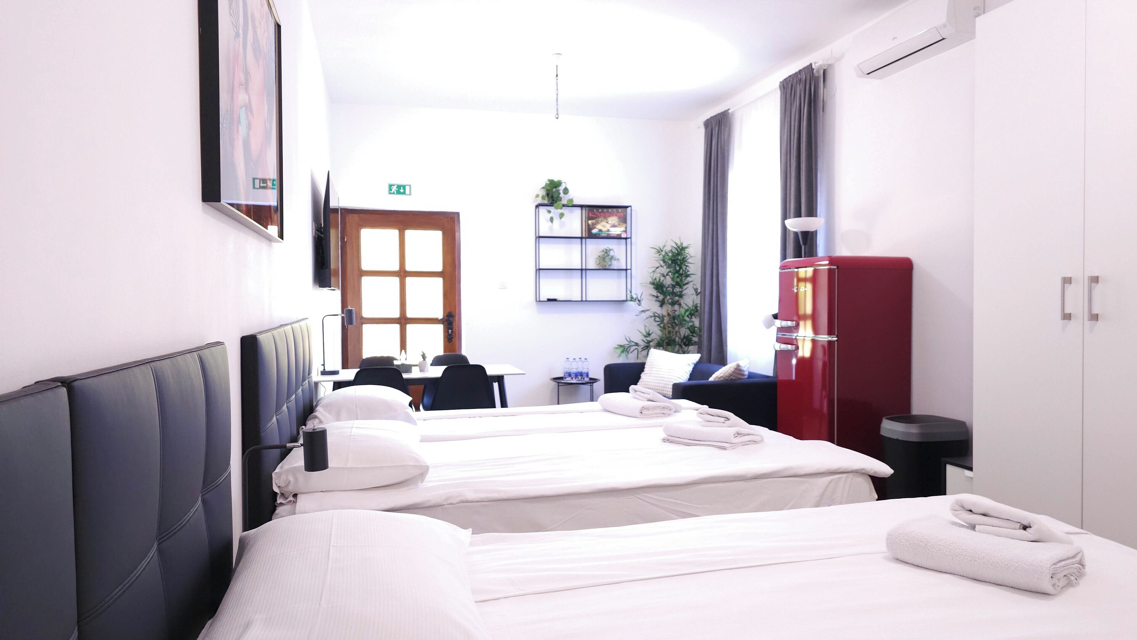 Superior Quadruple Room | Hypo-allergenic bedding, desk, laptop workspace, iron/ironing board