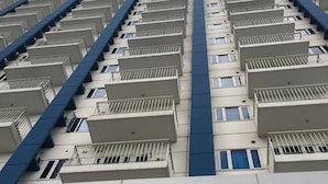 A high-rise building with multiple balconies and a uniform architectural style. - Light Residences - One Bedroom Condo Unit (Mandaluyong)