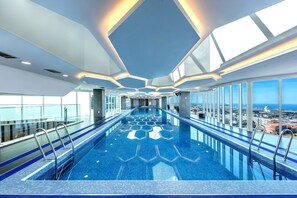 Indoor pool, open 7:00 AM to 9:00 PM, pool loungers