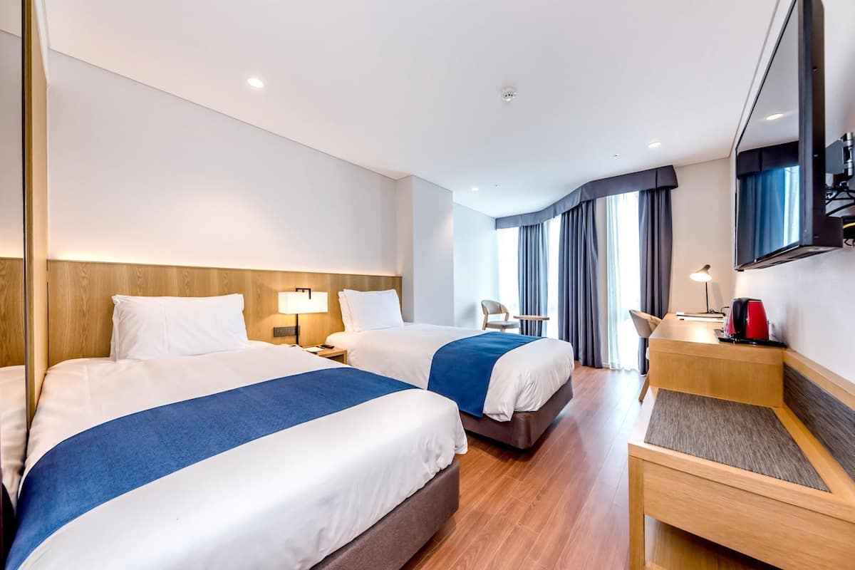 Premium bedding, down duvets, in-room safe, desk