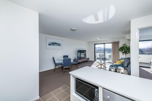 Deluxe Apartment | Living area | 50-inch flat-screen TV with cable channels, TV - Accommodate Canberra - Century (Griffith)