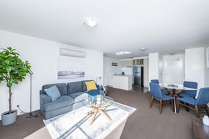 Deluxe Apartment | Living area | 50-inch flat-screen TV with cable channels, TV - Accommodate Canberra - Century (Griffith)