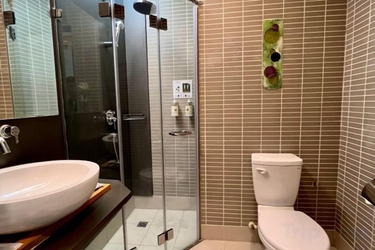 Bathroom | Hair dryer, slippers, towels, shampoo
