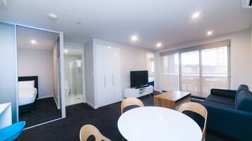 Apartment, 2 Bedrooms (Indigo 41) | Living area | Flat-screen TV