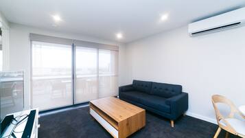 Apartment, 2 Bedrooms (Indigo 41) | Living room | Flat-screen TV