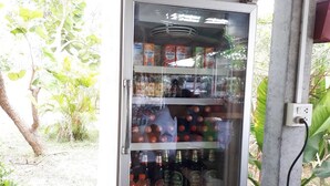 A vending machine with a 'SKY COOL' sign, stocked with various beverages. - Aranya Resort (Prakhon Chai)