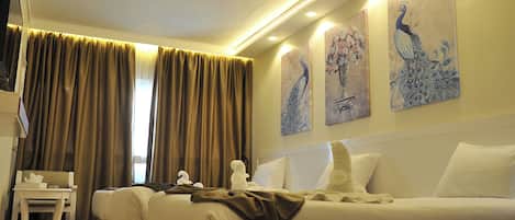 Deluxe Triple Room | Hypo-allergenic bedding, minibar, in-room safe, desk