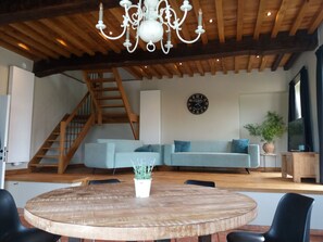 Deluxe Duplex, 2 Bedrooms | Living room | Flat-screen TV