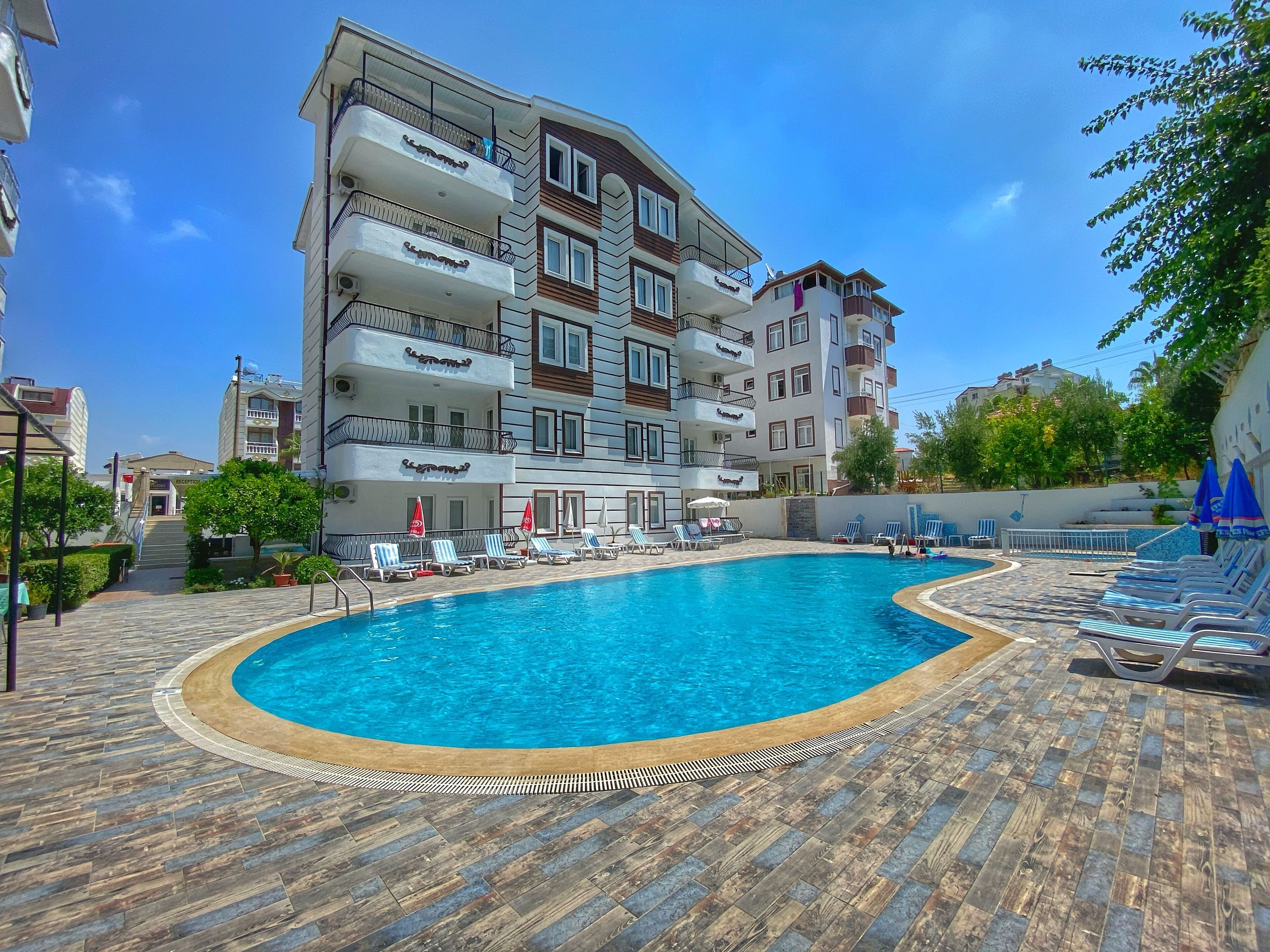 Seasonal outdoor pool, pool umbrellas, pool loungers