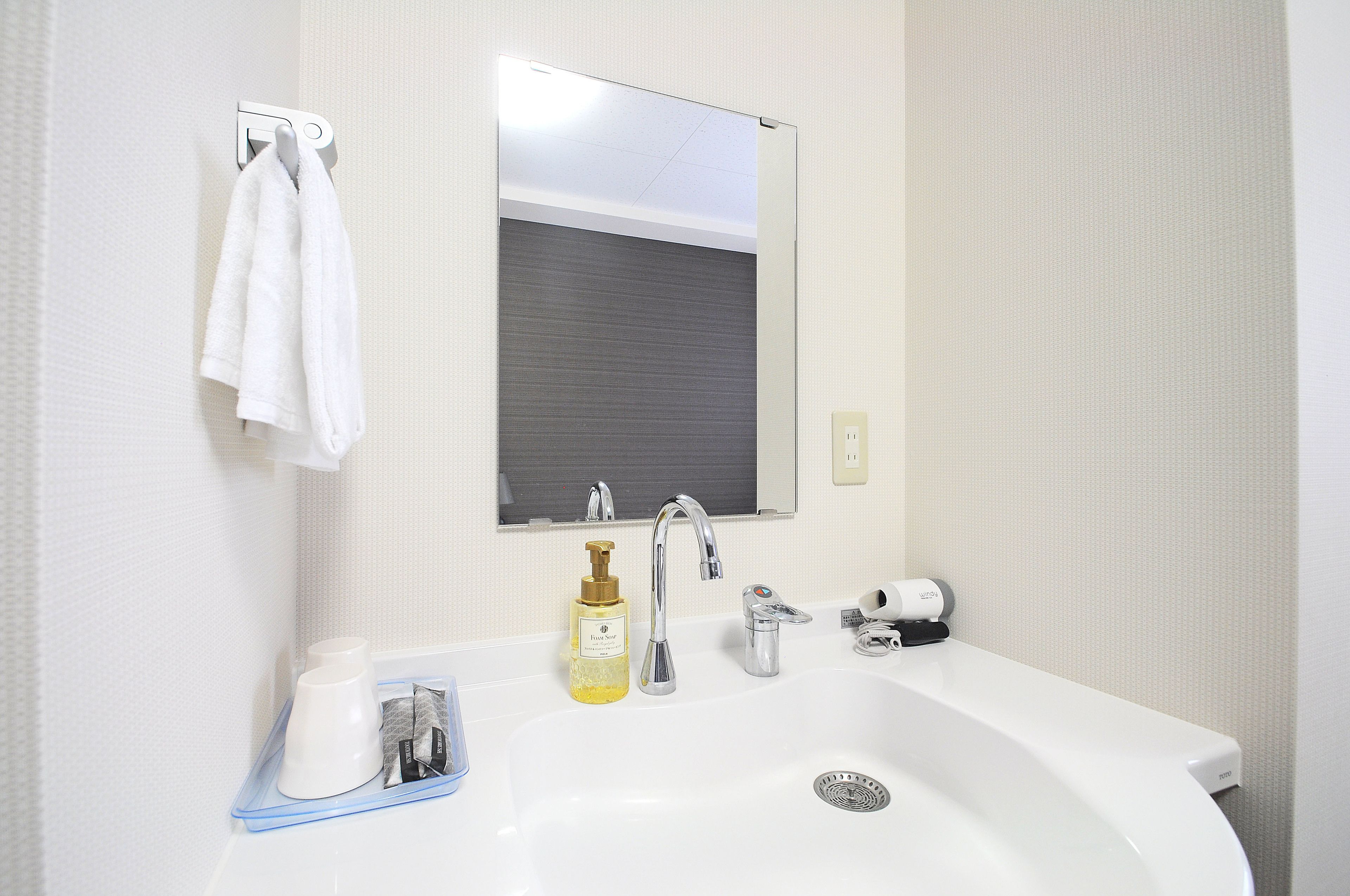 hair dryer, slippers, electronic bidet, towels