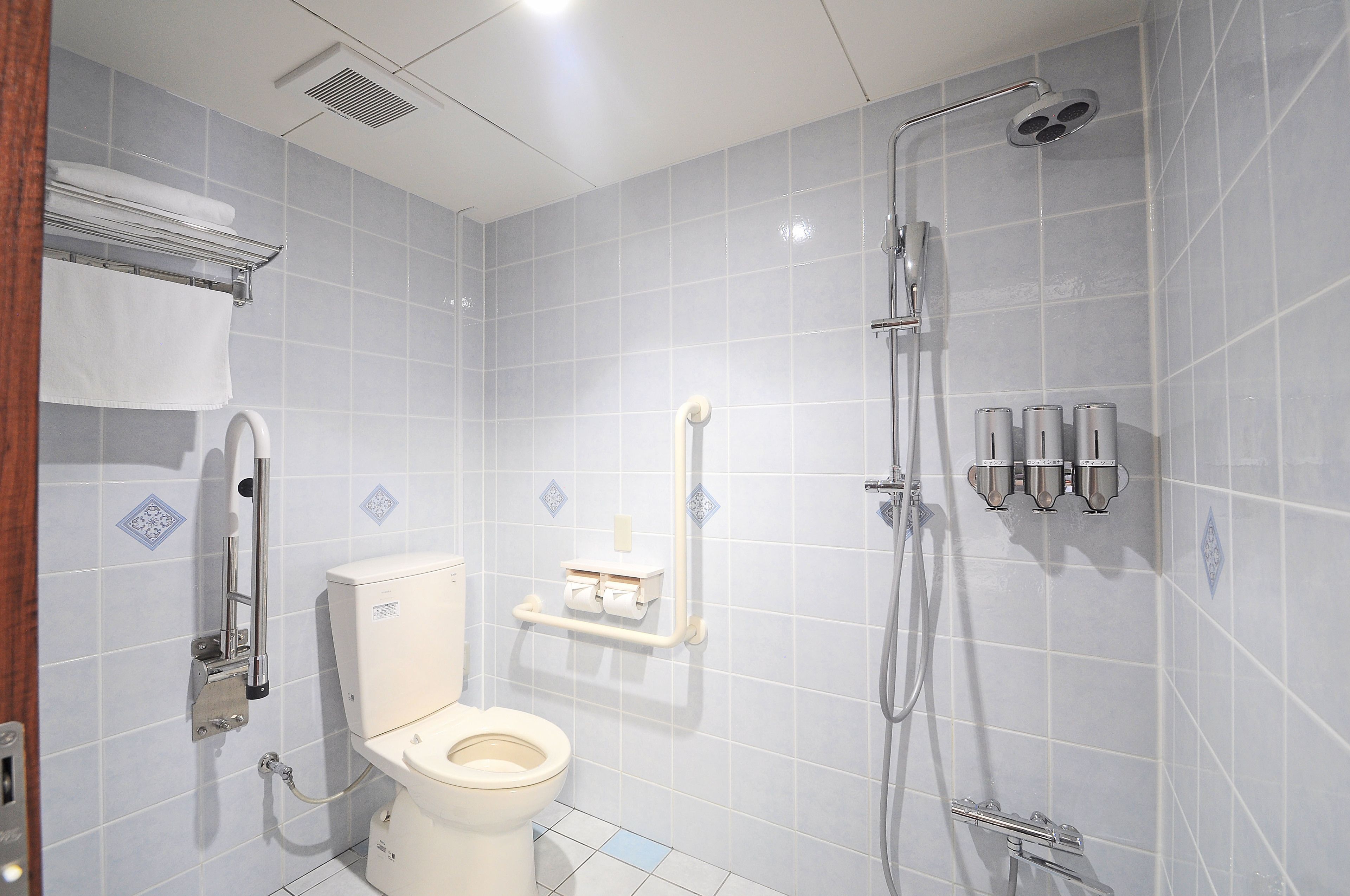 hair dryer, slippers, electronic bidet, towels